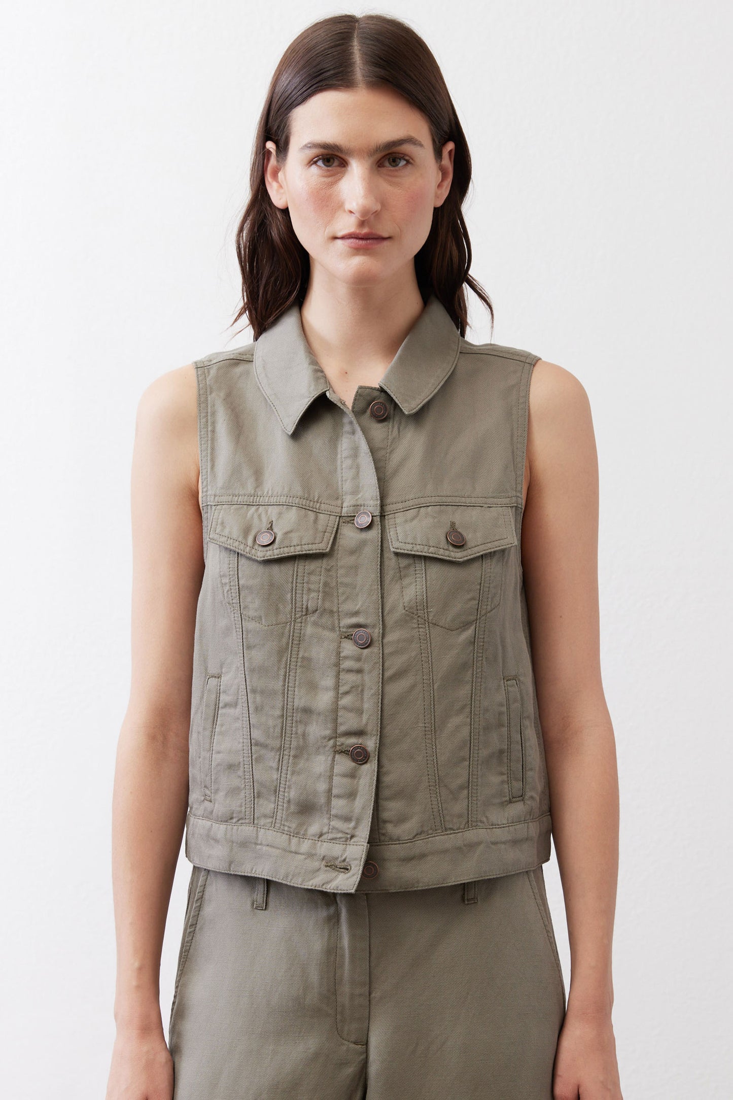 Olive green cropped task vest with button front and flap chest pockets