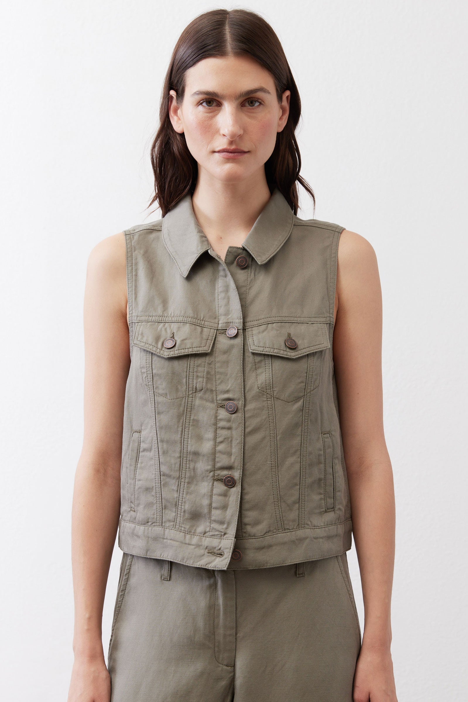 Olive green cropped task vest with button front and flap chest pockets