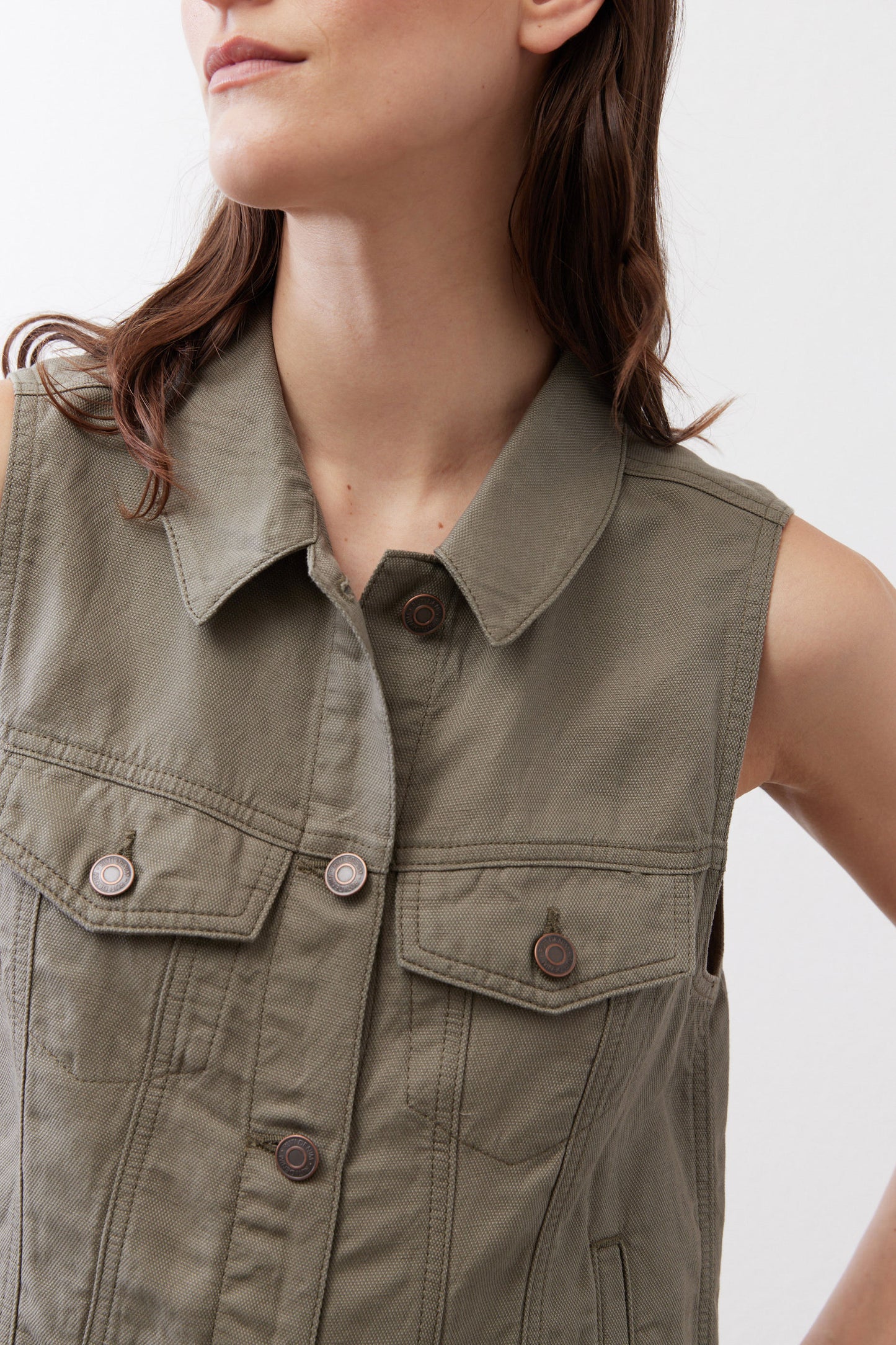 Olive green cropped task vest close-up of collar and chest flap pockets with snaps