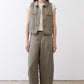 Olive green cropped task vest worn with matching wide-leg pants