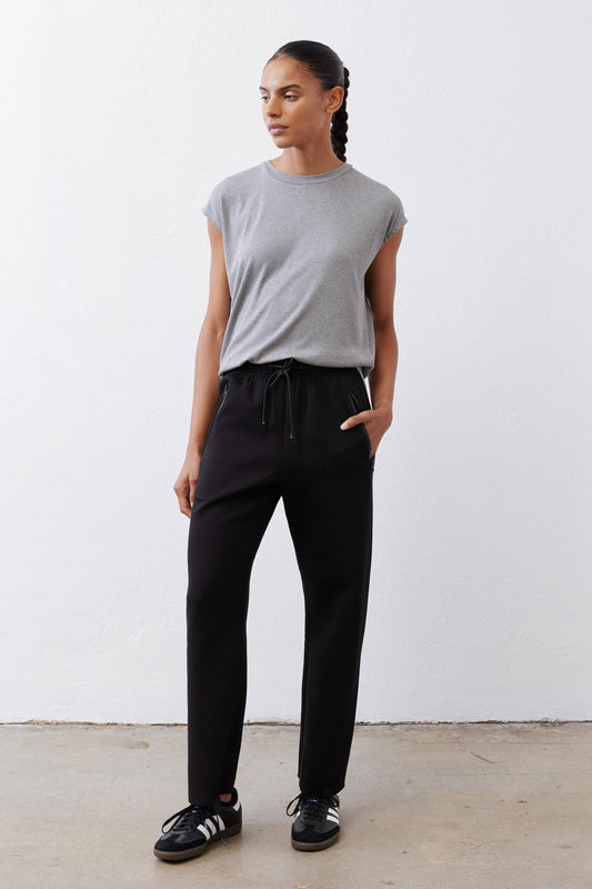 Black scuba pants with elastic drawstring waist and relaxed straight legs