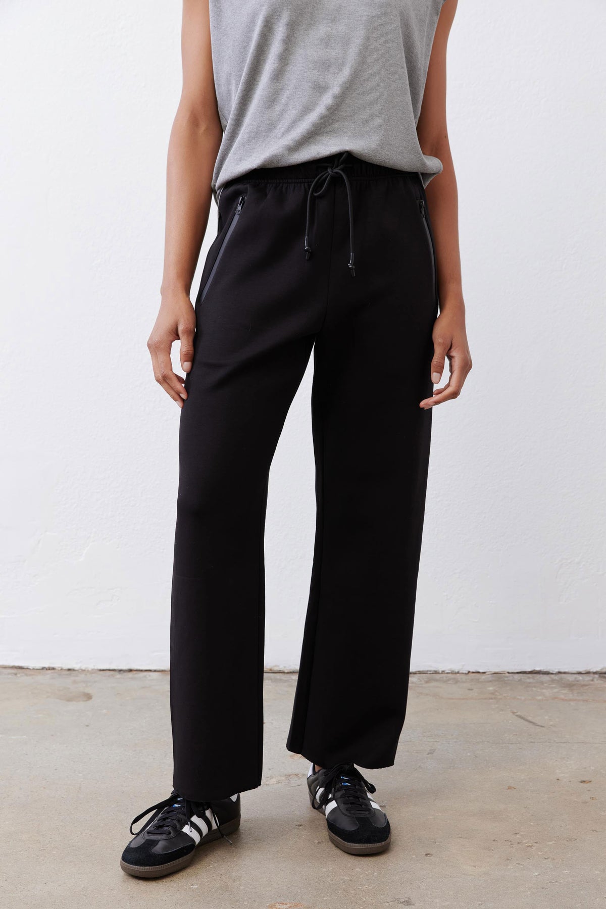 Black scuba pants with drawstring waist and wide-leg, ankle-length fit