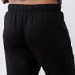 Black scuba pants close-up: elastic waistband with drawstring