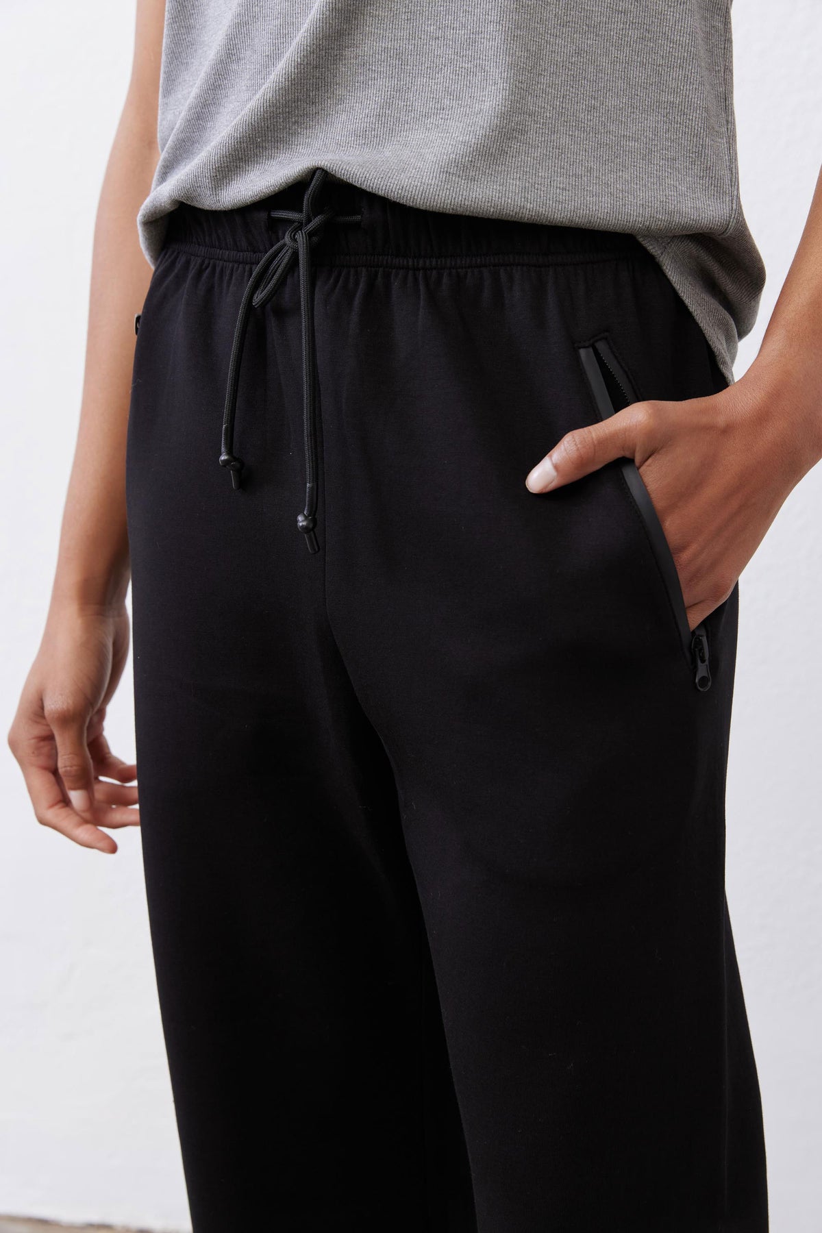 Black scuba pants front view with drawstring tie and elastic waistband
