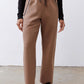 Fawn scuba pants close-up of legs, elastic waist and drawstring with dark accents