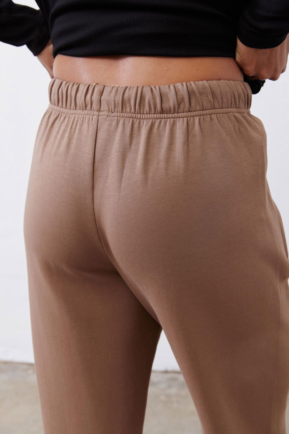 Fawn scuba pants waistband close-up with gathered elastic and smooth fabric