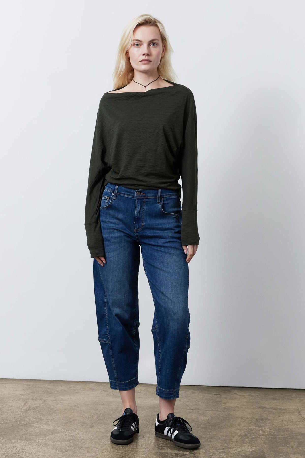 Dark green dolman top with boat-style neckline and long sleeves