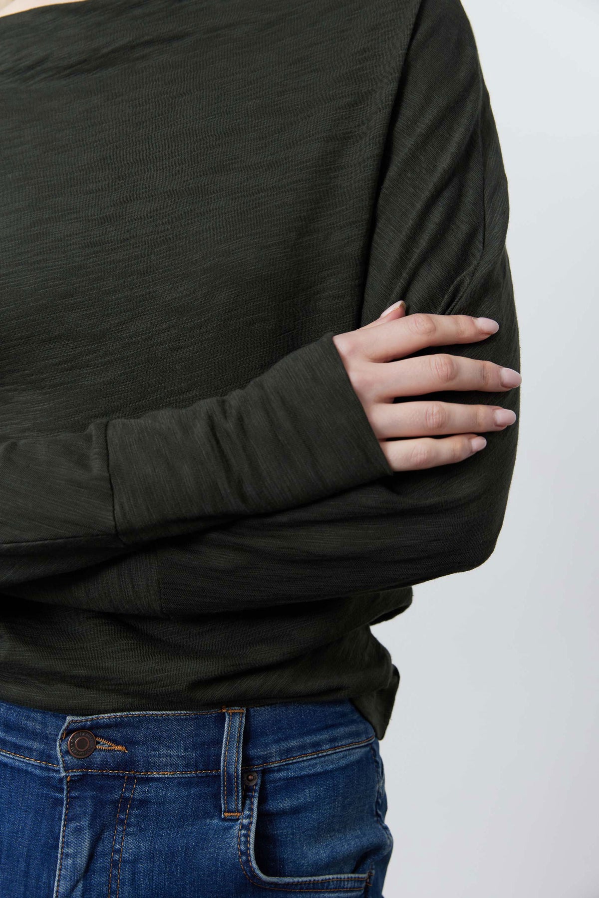 Dark green dolman top, long relaxed sleeves and crew neckline