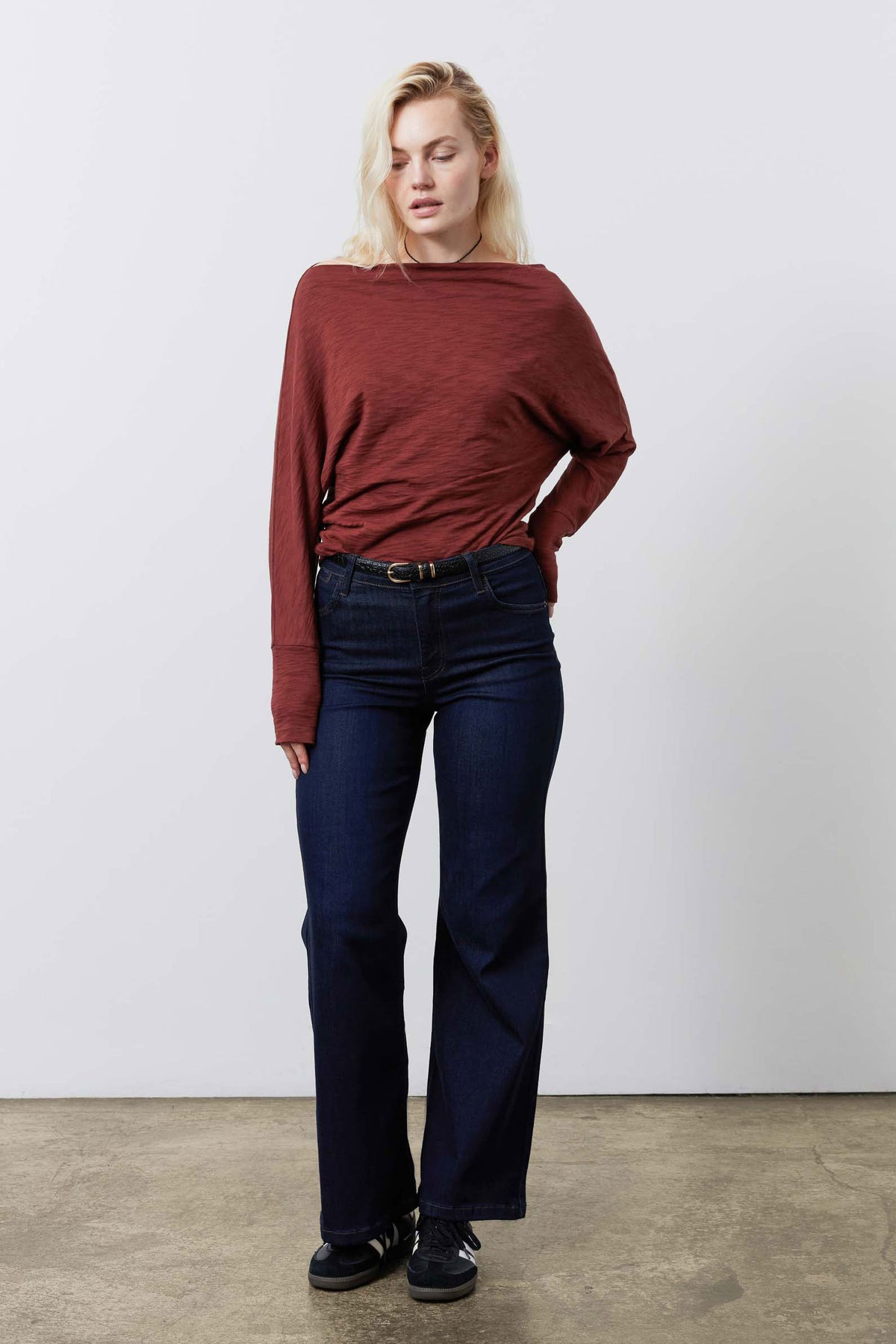 Reddish-brown dolman top with boatlike neckline and long cuffed sleeves