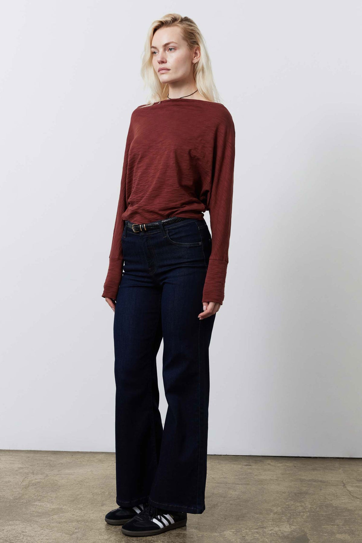 Reddish-brown dolman long-sleeve top with relaxed silhouette