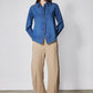 Medium-wash denim zip-front blouse with stand collar and long sleeves, front view