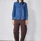 Medium-wash denim zip-front blouse with stand collar and long sleeves