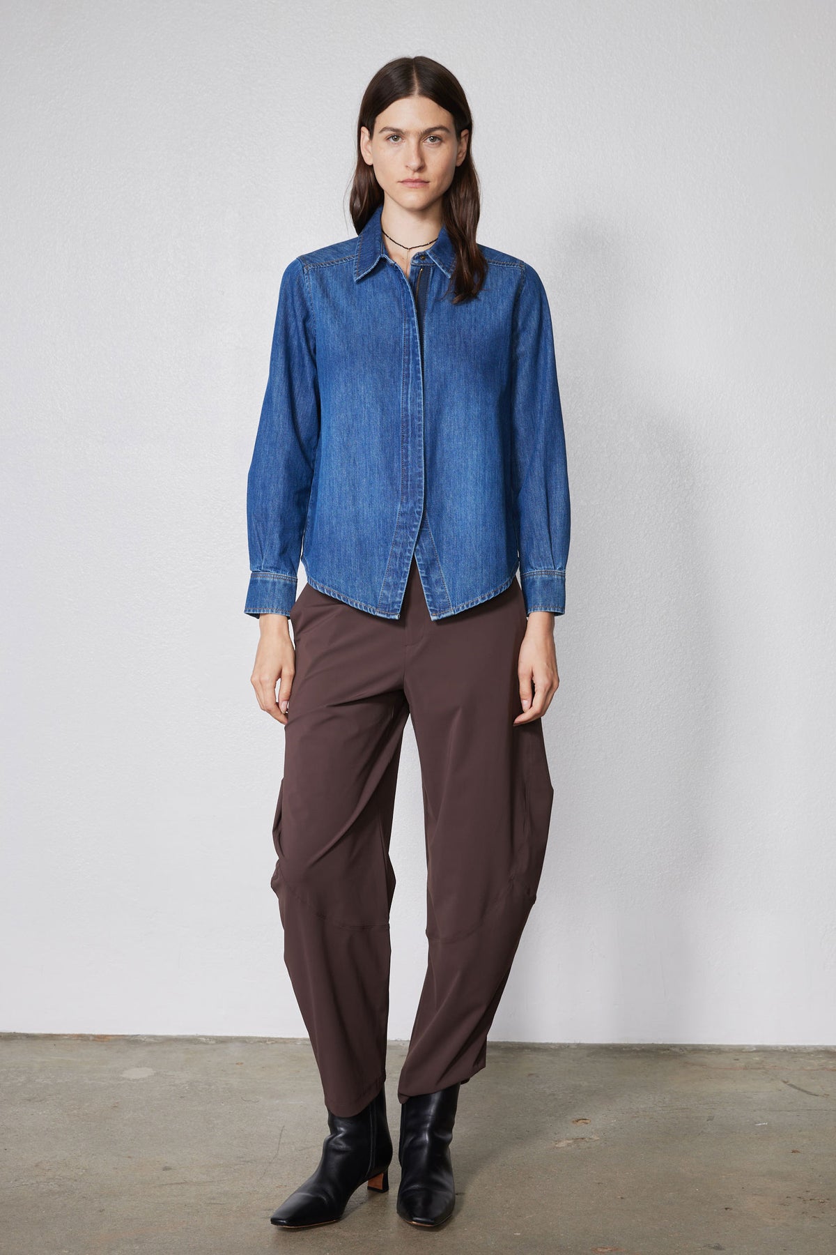 Medium-wash denim zip-front blouse with stand collar and long sleeves