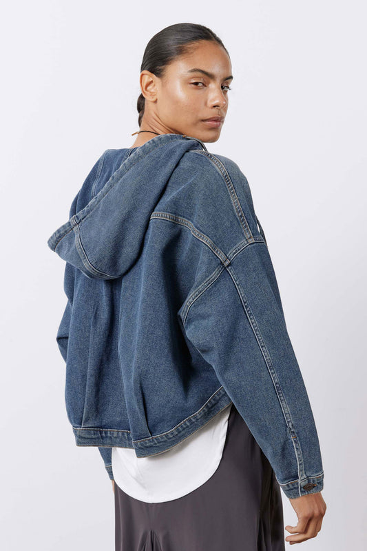 Washed denim jacket with oversized hood, button cuffs, shoulder yoke detail