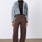 Washed-blue denim jacket with button front, dark knit turtleneck underneath