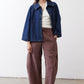 Denim cropped swing jacket in medium wash with chest patch pockets and button-front