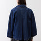 Denim cropped swing jacket back view, medium wash, center seam and curved hem