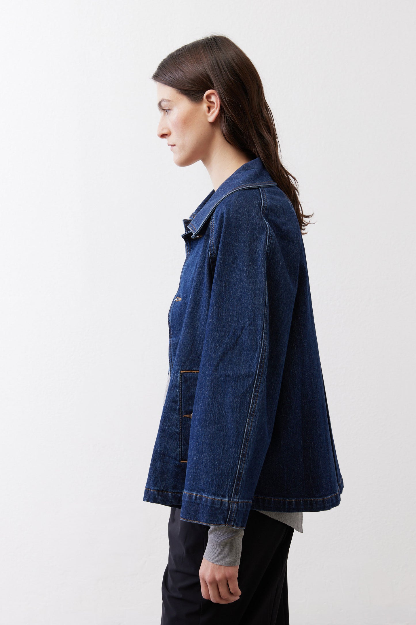 Denim cropped swing jacket, medium wash, side view with button cuff detail