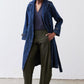 Dark blue denim trench coat with gold-tone buttons and belted waist, open front