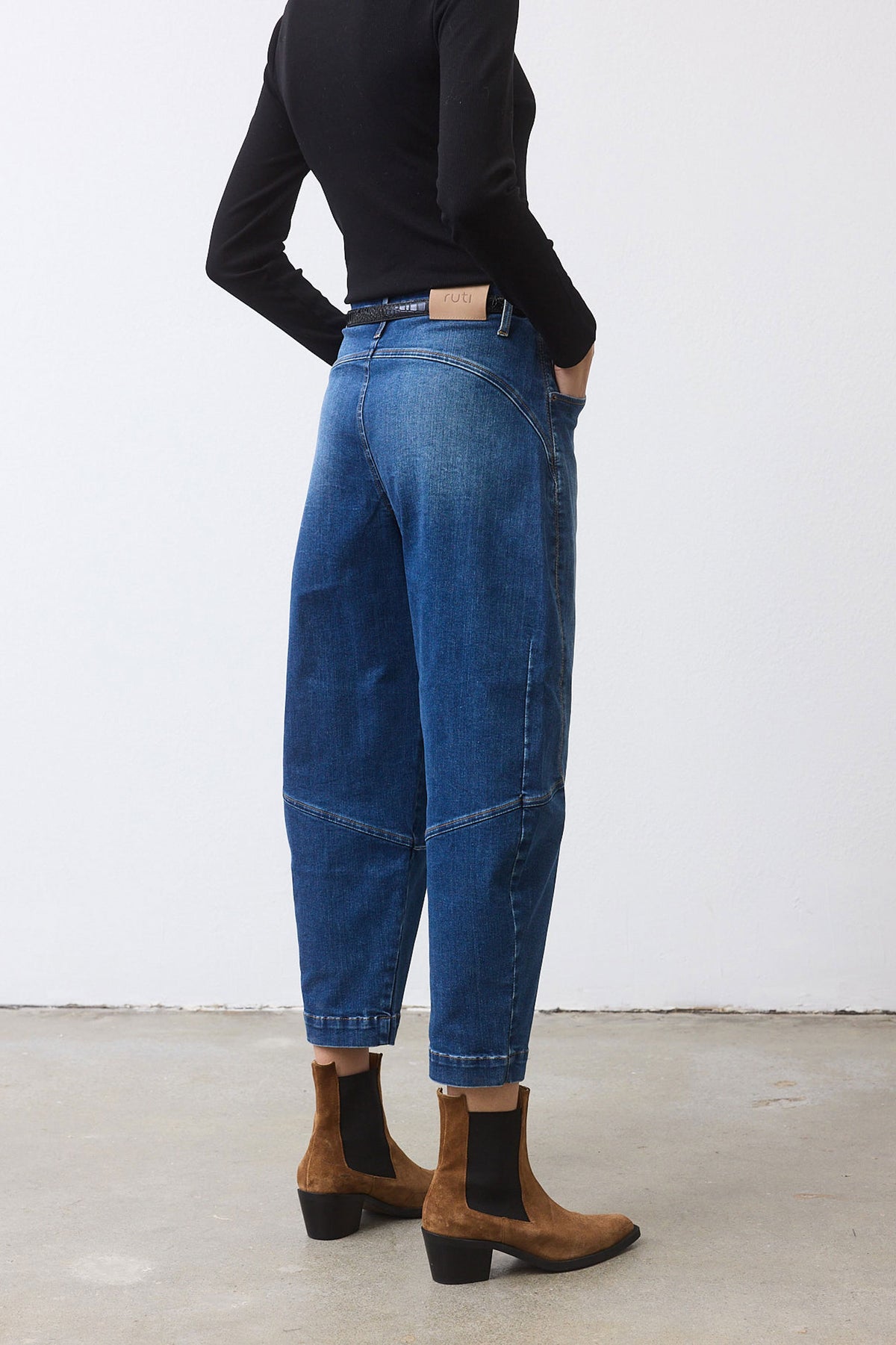 Medium-wash denim wide-leg pants with straight wide silhouette and belt loops