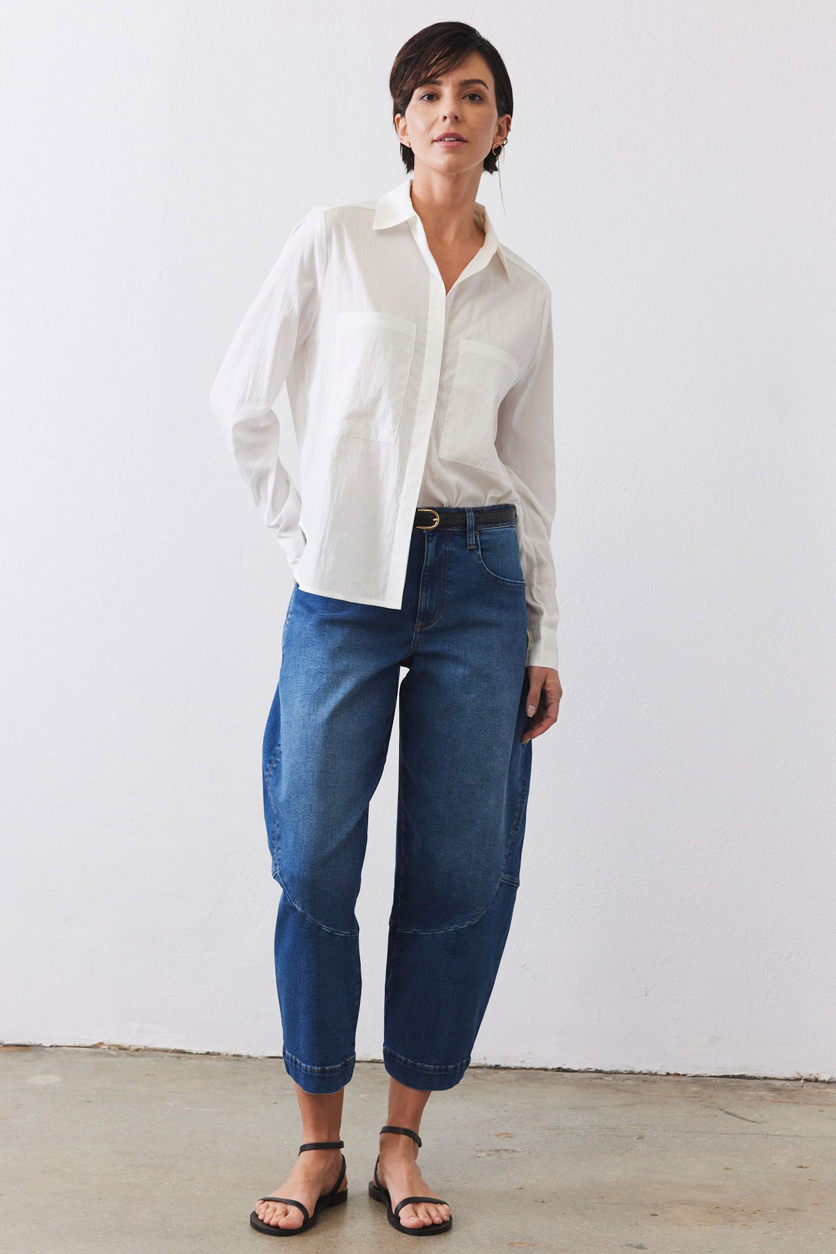 Medium-wash denim wide-leg pants with relaxed straight legs and belt loops
