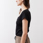 Black short-sleeve top with square neckline and ruched front, side view