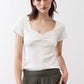 Ivory square-neck dipped top with short sleeves and gathered front at the bust