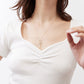 Ivory square-neck dipped top with ruched center seam and short sleeves