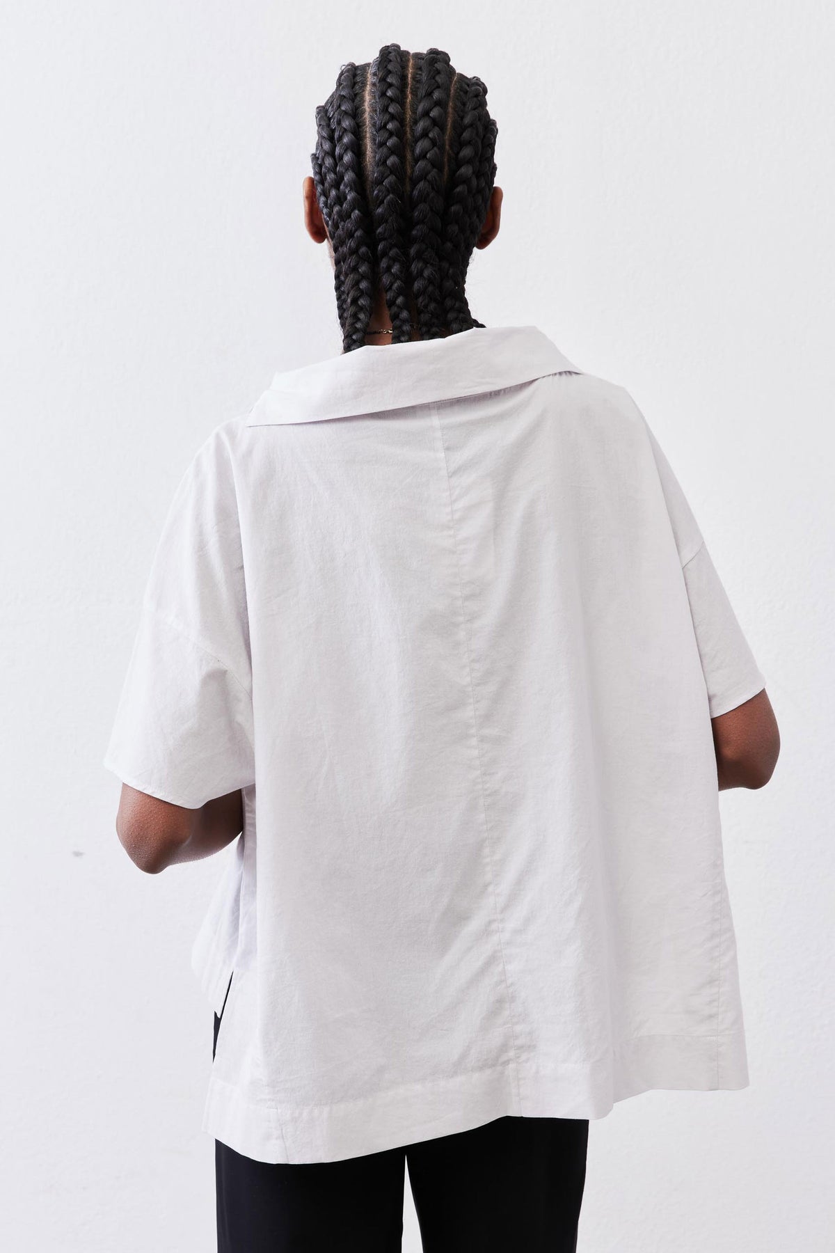 White dolman drape-neck top back with relaxed short sleeves and draped hood