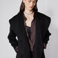 Black cropped wool coat with notch lapels, double-breasted front and button closure