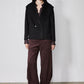 Black cropped double-faced wool coat with pointed lapels, buttoned closure and pockets