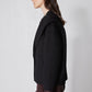 Black cropped wool coat in side view with structured shoulders and buttoned front