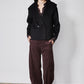 Black cropped wool coat with notch lapels and two-button double-breasted closure