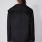 Black cropped wool coat back view with shoulder yoke seam and smooth finish