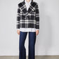 Cropped wool coat in black and white plaid with notched lapels and button front