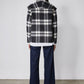 Cropped wool coat back view in black and white plaid with yoke and button closures