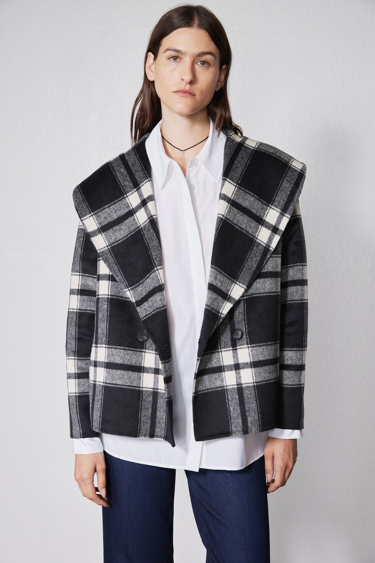 Cropped double-faced wool coat in black and white plaid, front view with button closure