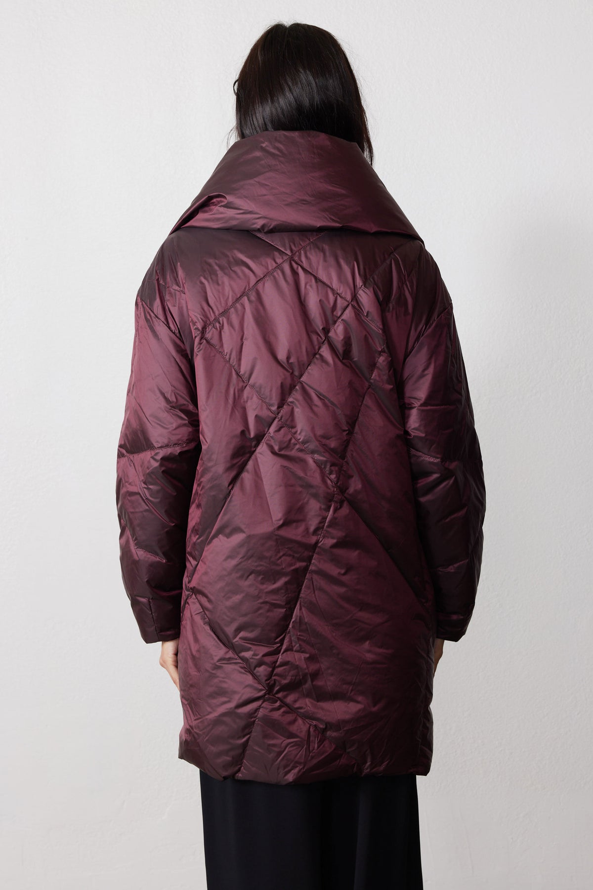 Back view of the mulberry puffer jacket with diamond quilting and a wide folded collar
