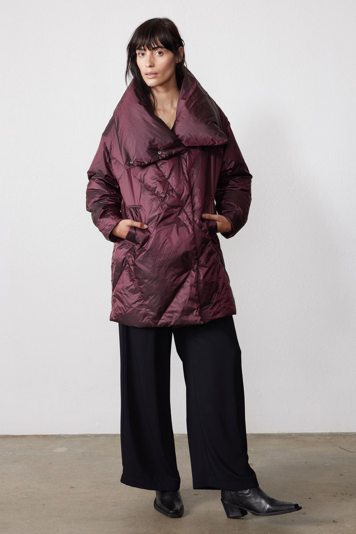 Full-length view of the mulberry puffer jacket with front pockets and an oversized collar