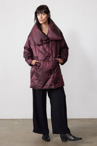 Full-length view of the mulberry puffer jacket with front pockets and an oversized collar