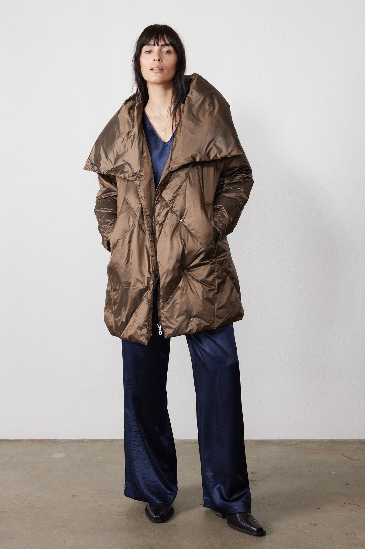Walnut puffer jacket with oversized collar, long sleeves, and front pockets