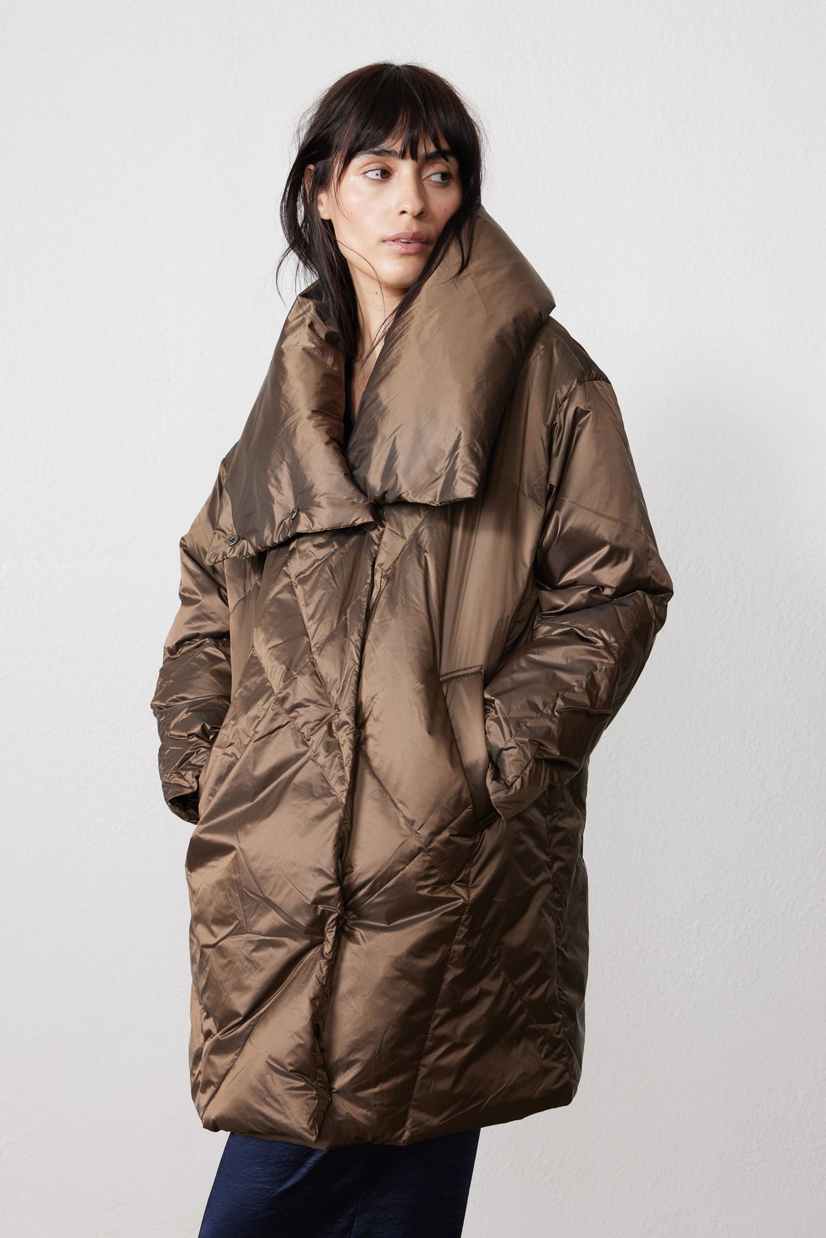 Walnut puffer jacket with high collar, snap front, and roomy pockets