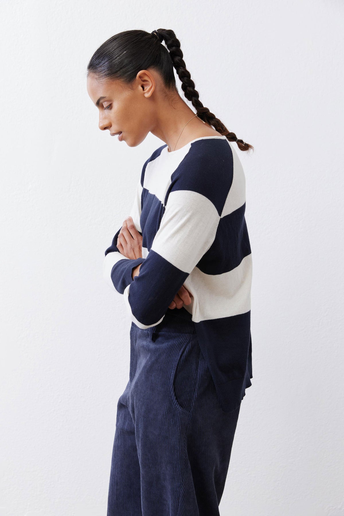 Navy and cream striped raglan sweater, side profile with sleeve