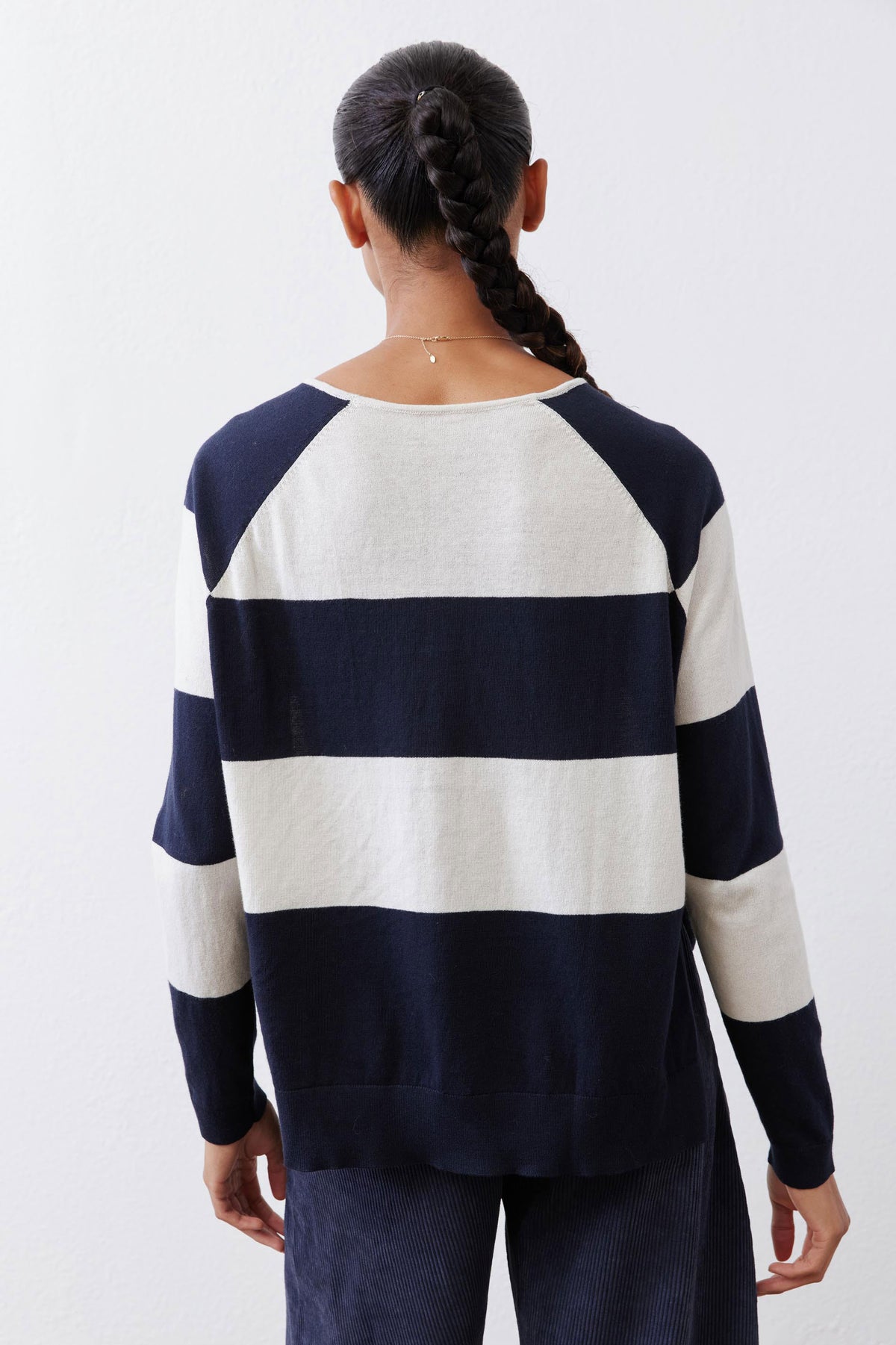 Back view of navy and cream striped raglan sweater