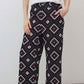 Wide-leg trousers with dark background and diamond geometric print, relaxed fit