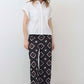 Wide-leg trousers with navy, red, and white diamond geometric pattern