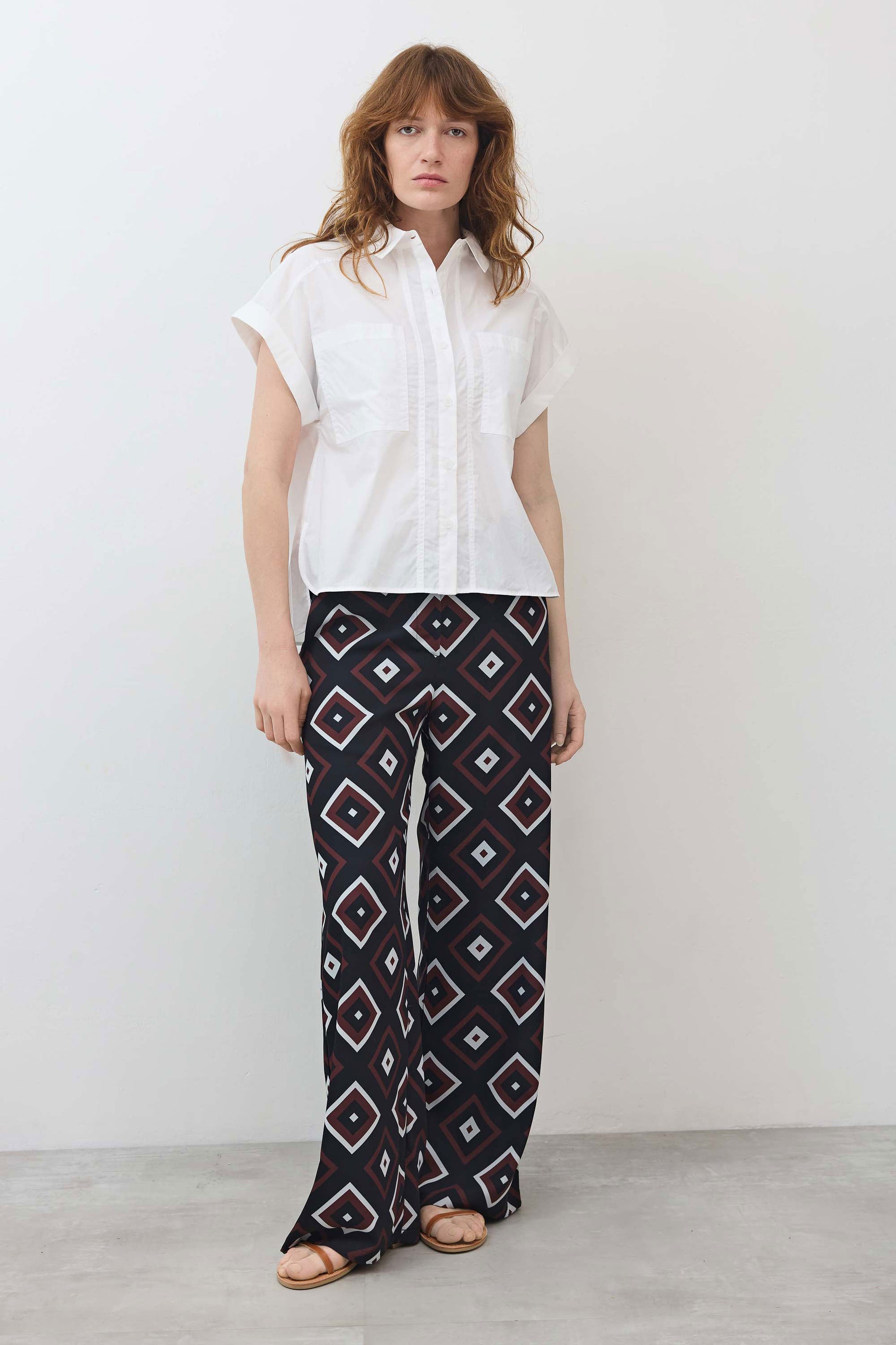 Wide-leg trousers with navy, red, and white diamond geometric pattern