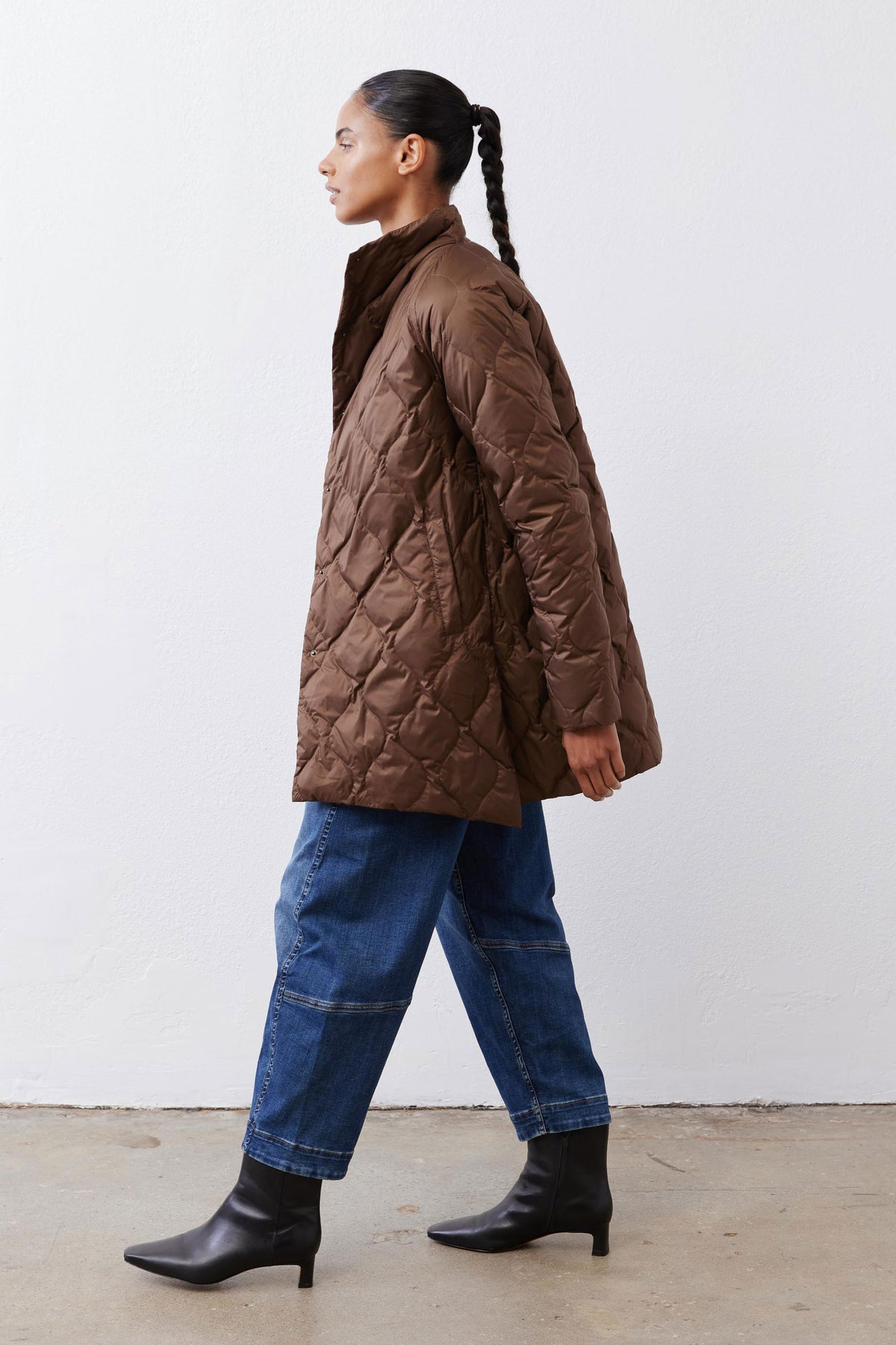 Bistro Brown quilted puffer coat with high collar and long sleeves, side view