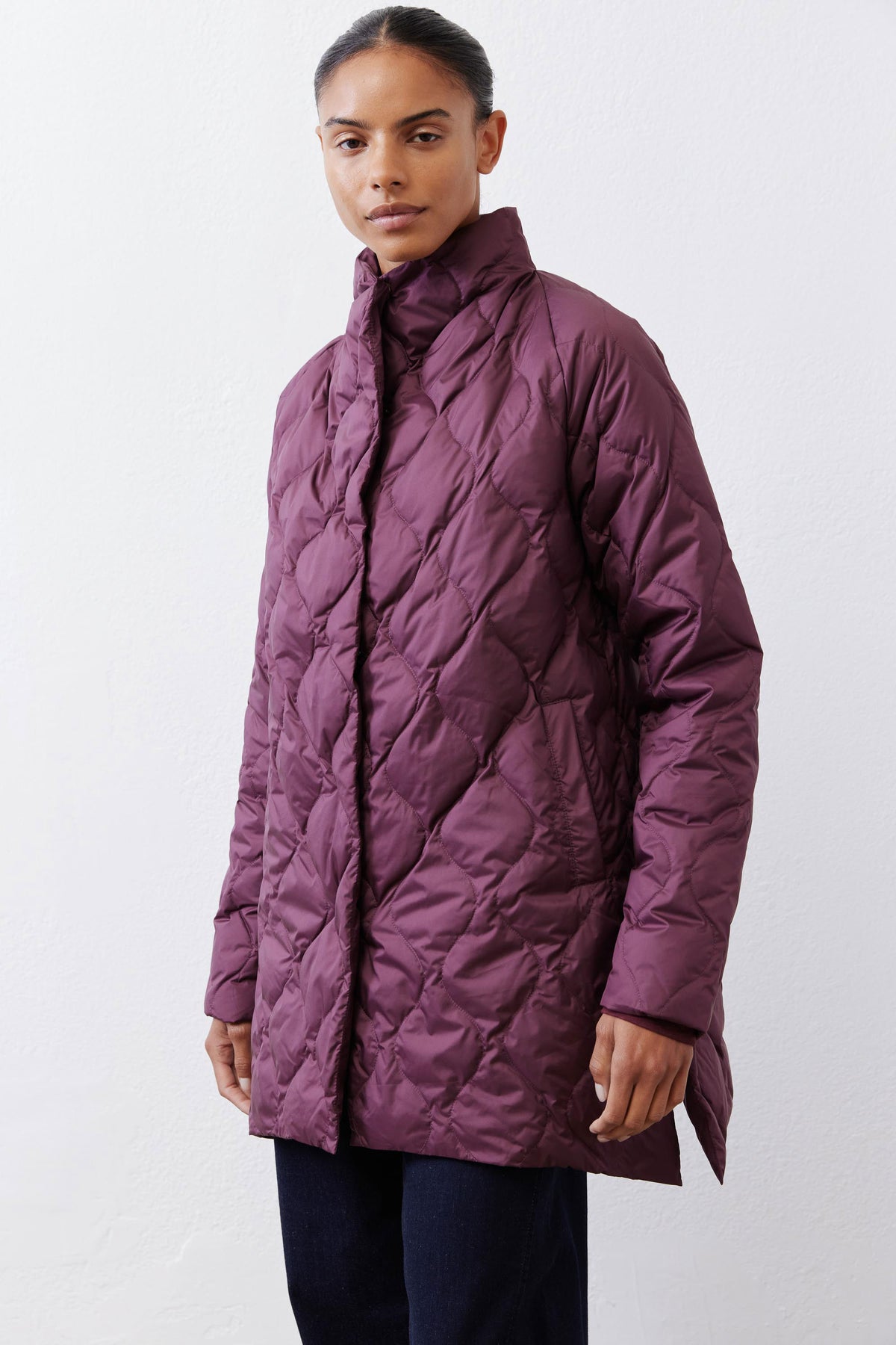 Deep plum quilted down puffer coat with zip front and long sleeves