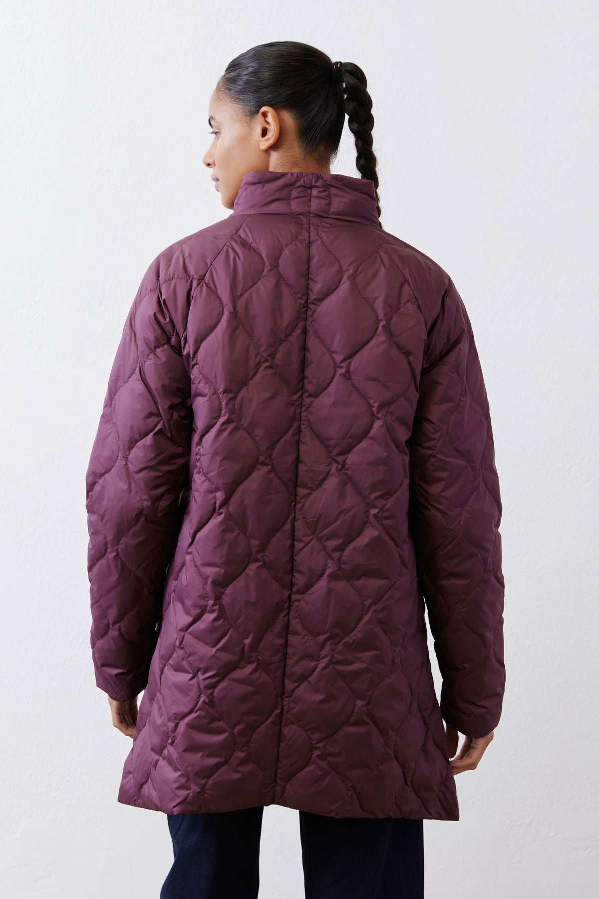 Deep plum hooded down puffer coat back view with quilted pattern